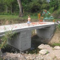 This bridge allows students to walk to school during the rainy season.